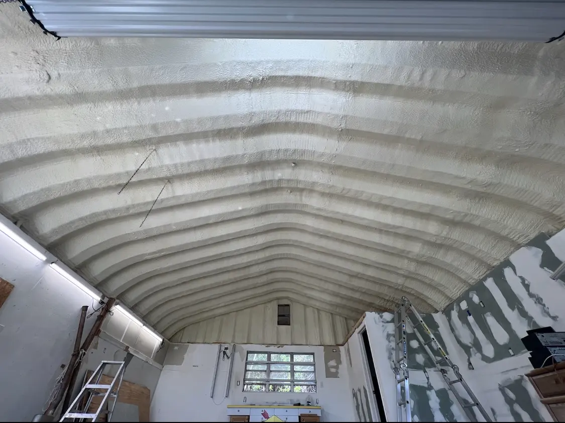 Spray polyurethane foam applied to the underside of a metal roof deck in North Branch